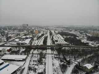 Aerial view of the automobile bridge over the railway in winter (Kirov, Russia).
