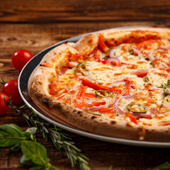 Pizza with holopeno, onion and cheese on wooden background