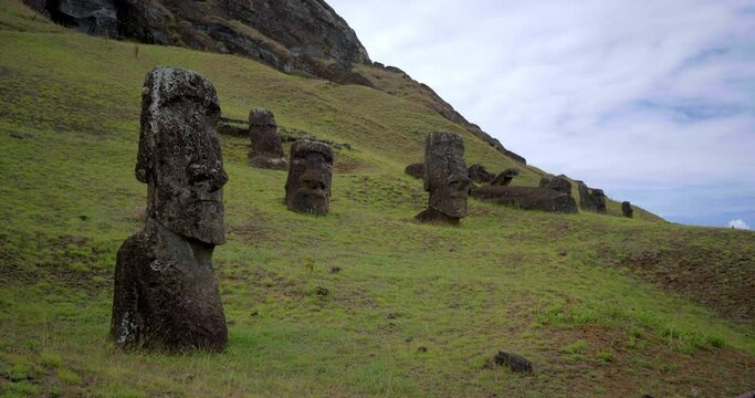 Low angle, ancient Easter Island hillside statue