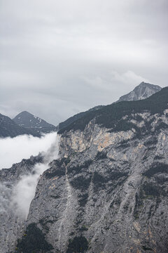 mountain peak in the mist. Swiss alps in the clouds.