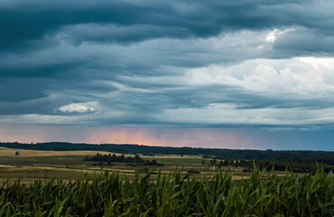Dramatic sky over the fields. Agricultural landscape in eastern Lithuania.