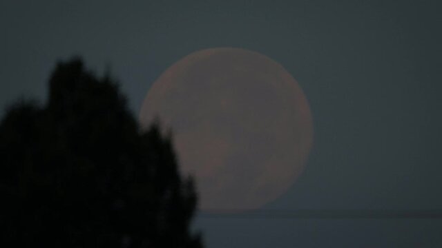 Timelapse of full moon in Utah sky, wide