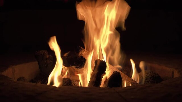 Burning campfire at night, close up