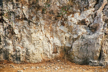 Old rusty blank metal sign in front limestone mountains background in Thailand. Limestone mountain texture.
