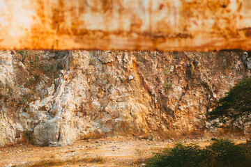 Old rusty blank metal sign in front limestone mountains background in Thailand. Limestone mountain texture.
