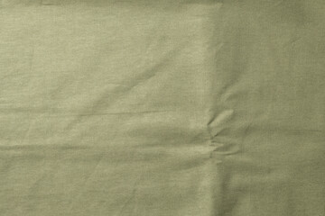 Linen tablecloth, background for text, green, olive color. Fabric texture