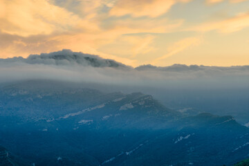 Obraz premium Sunrise in the mountains (the Peak of Comanegra covered with fog - Alta Garrotxa, Catalonia, Spain)
