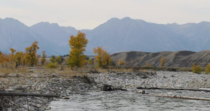 Grand Teton River Mountains Smokey Skies From Forest Fires 4K. Grand Teton National Park. Destination For Mountaineering, Hiking, Fishing And Recreation. Geography, Geology, Environment, History.