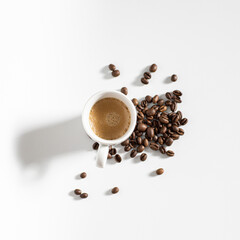 full coffee cup on white background with beans