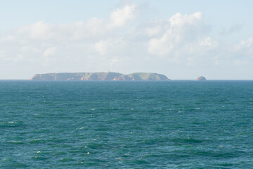 Berlengas island seen from Cabo Carvoeiro Cape in Peniche and atlantic ocean waves, in Portugal