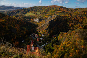 Fototapeta na wymiar Romantic medieval village with monastery in autumn, Saint John under the Cliff (Svaty Jan pod Skalou), Central Bohemia, Czech Republic