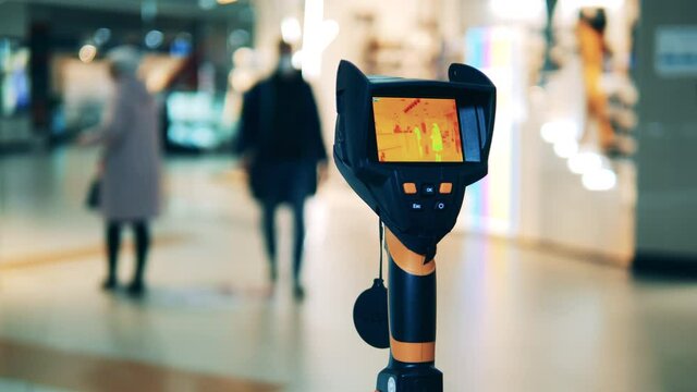 Public place with a thermovision device scanning it