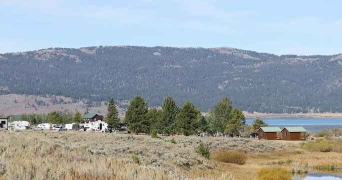 Henrys Lake Idaho RV park and campground mountain 4K. Shallow alpine lake in eastern Idaho. At the Continental Divide near Yellowstone National Park and Island Park. Mountain valley recreation.
