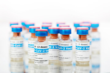 Bottles of new SARS-CoV-2 vaccine on table ready for application