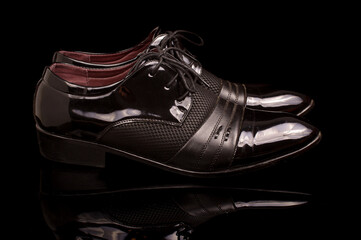 Pair of black stylish male shoes isolated