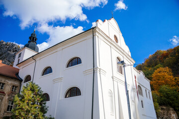Romantic medieval village with monastery in autumn, Saint John under the Cliff (Svaty Jan pod...
