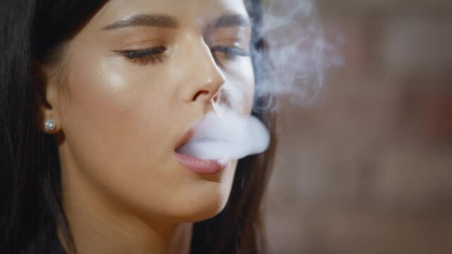 girl smokes an electronic cigarette