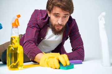 man sitting on floor with bucket homework service room