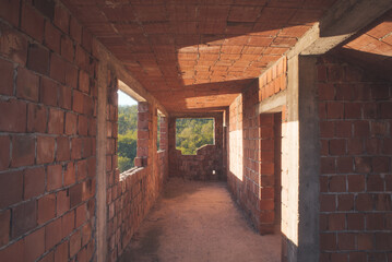 Obraz premium House construction interior with red bricks