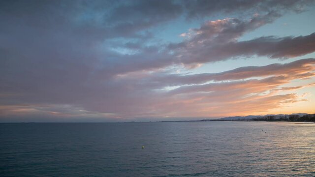 Forward and reverse timelapse of sunset over the mediterranean sea
