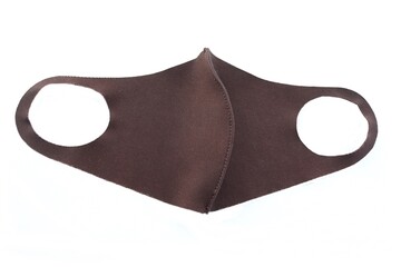Brown face mask wearing for virus protection corona COVID-19 isolated on white background closeup.