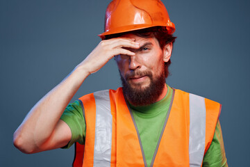 Bearded man in work uniform construction professional cropped view