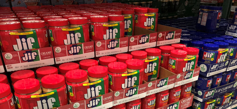 BAXTER, MN - 8 DEC 2019: Store display of Peanut Butter for sale. Jif is an American brand of peanut butter made by The J.M. Smucker Company, Red and blue jars.