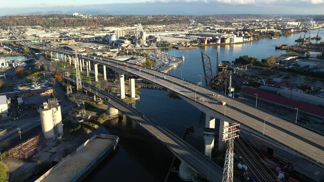 Aerial / drone footage of West Seattle, the West Seattle bridge, Harbor Island, Duwamish Waterway, Green River, Seattle Harbor terminals, Elliott Bay in Seattle, King County, Washington