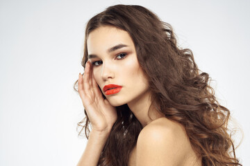 Fototapeta premium Elegant woman with bare shoulders red lips glamor attractive look cropped look