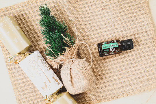 Mudgee, New South Wales / Australia - November 1 2020:  Doterra essential oil illustrative product image in Christmas setting, Holiday Peace