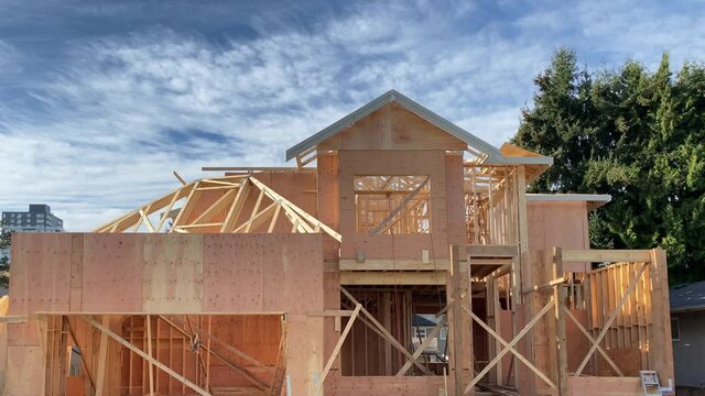 House under construction. The site with wooden frame. Still camera view.