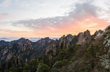 Fototapeta na wymiar The sea of clouds and sunrise in the winter morning in the North Seascape of Huangshan Mountain, Anhui, China