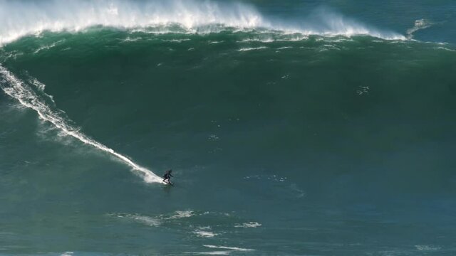 Slow motion of a big wave surfer riding one of the largest monster waves in Nazar&eacute;, Portugal. Nazar&eacute; is a small village in Portugal with the biggest waves in the world.