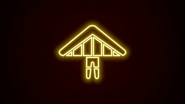 Glowing neon line Hang glider icon isolated on black background. Extreme sport. 4K Video motion graphic animation