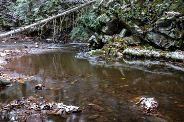 Stream in the winter forest. Winter wonderland at Union Mine Trail, Porcupine Mountains Wilderness State Park in Michigan