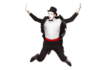 Portrait of a male mime artist performing, isolated on white background. Jumps high with his hands...