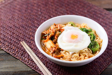 Korean food, Spicy noodles soup with kimchi and egg, Top view