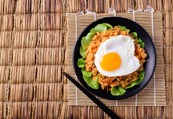 Korean food, Kimchi fried rice with fried egg on top, Top view