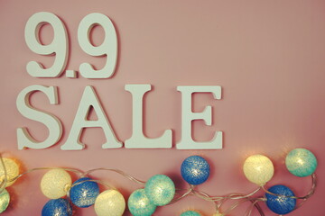 9.9 Sale alphabet letter with LED cotton balls on pink background