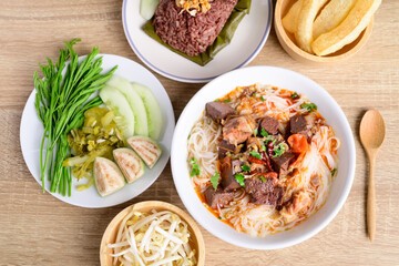 Northern Thai food (Kanom Jeen Nam Ngeaw), Rice noodles spicy soup with pork and pork blood eating with fresh vegetables and pork rind