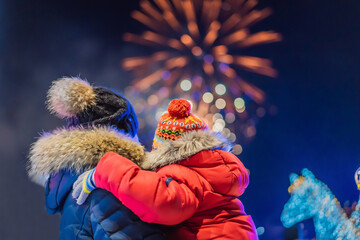 happy family looking fireworks in the evening sky. fireworks new year, christmas. Crazy 2020 is...