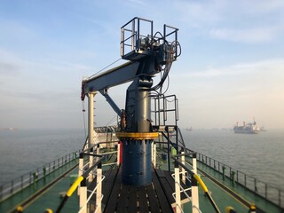 Hydraulic crane on the tanker ship