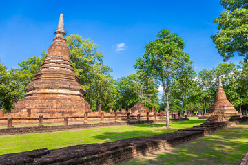 Landmark of old chedi made of ancient bricks in the Kamphaeng Phet Historical Park, Thailand.