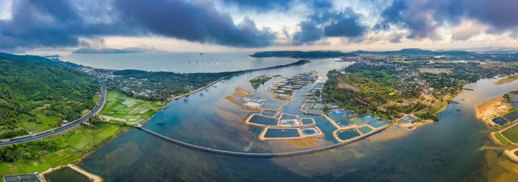 Aerial view of  white shrimp ( prawn ) farm with aerator pump in front of Tuy An, Phu Yen, Vietnam.