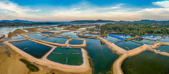 Aerial view of  white shrimp ( prawn ) farm with aerator pump in front of Tuy An, Phu Yen, Vietnam.