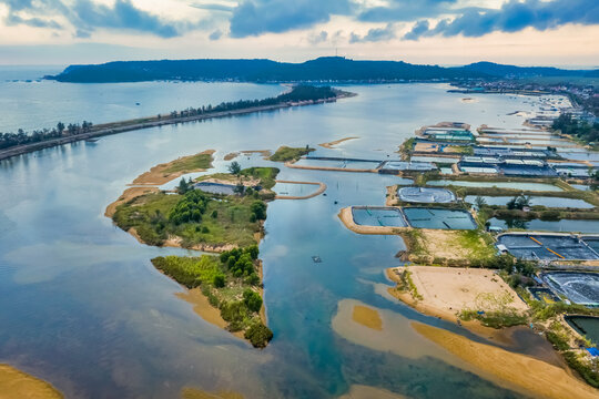 Aerial view of  white shrimp ( prawn ) farm with aerator pump in front of Tuy An, Phu Yen, Vietnam.