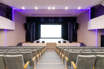 Concert hall of the theater with red new chairs. The interior of the hall in the theater or cinema...