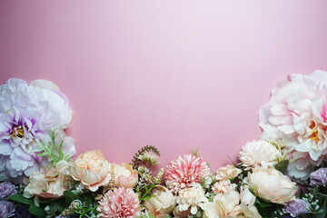 Fototapeta na wymiar Flowers Border Frame wiht space copy on pink background