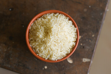 Traditional Indian raw basmati Rice used to make biryani or pulao , uncooked heart healthy food with Indian spices Kerala India. Jasmine or Jeera rice for making Biriyani or pulav 