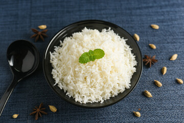 Cooked basmati Rice used to make biryani or pulao , heart healthy food with Indian spices Kerala India. Jasmine or Jeera rice for making Biriyani or pulav 